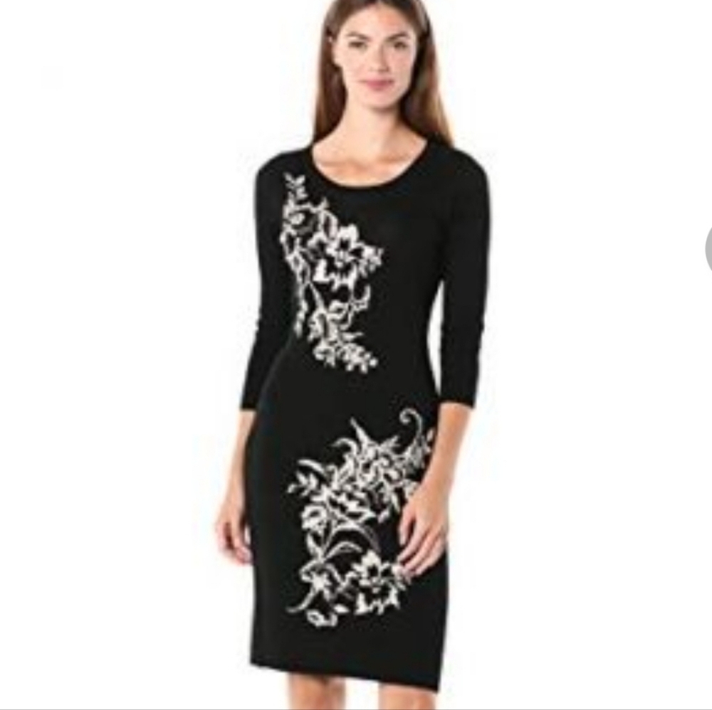 Black sweater dress with a floral detail